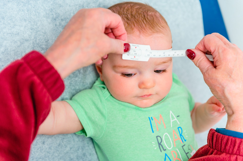 baby getting its head measured